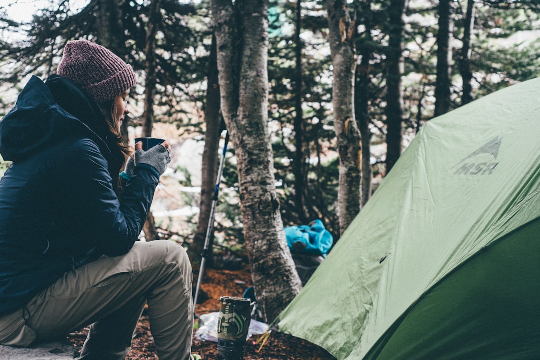 heros-img Female camper enjoying morning tea